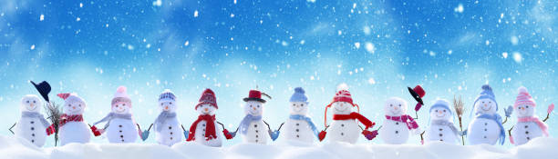 Merry Christmas and happy New Year greeting card with copy-space.Many snowmen standing in winter Christmas landscape.Winter background Merry Christmas and happy New Year greeting card with copy-space.Many snowmen standing in winter Christmas landscape.Winter background snowman stock pictures, royalty-free photos & images