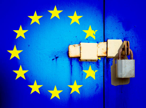 istock EU flag is on texture. Template. Coronavirus pandemic. Countries may be closed. Locks. 1283564973