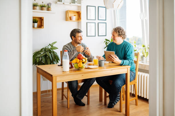 istock Mature gay couple eating breakfast 1283569379