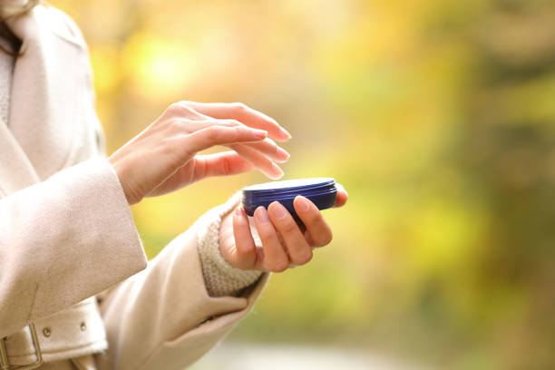 istock Woman hands in autumn holding a moisturizer bottle 1283569508