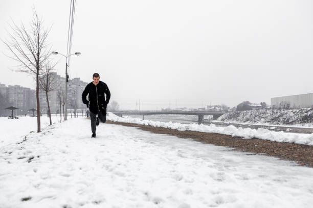 istock Man jogging on the snow 1283570767