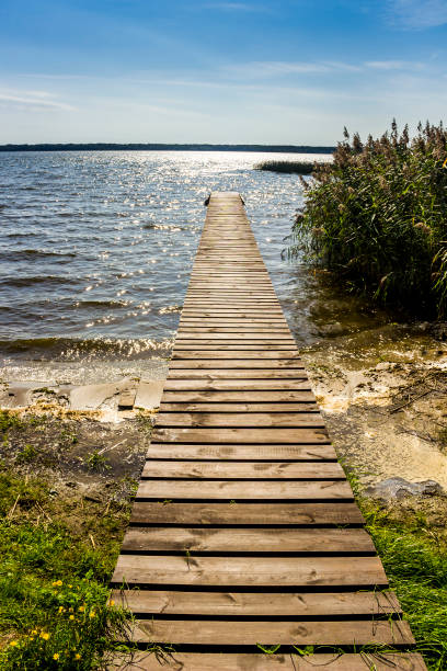 istock wooden pier on the lake 1283571351