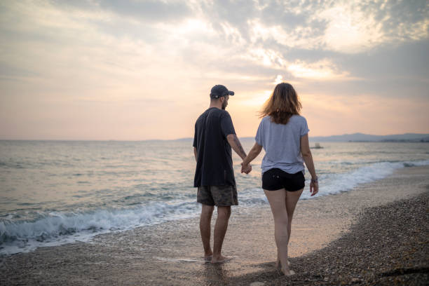 istock Lovely Middle Eastern Couple At Beach 1283572577