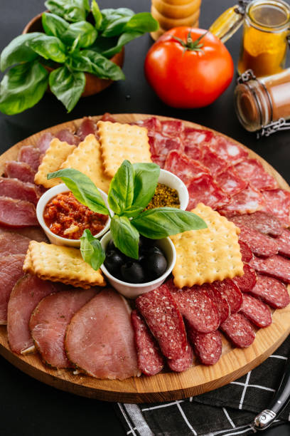 istock various meats and ham sliced on a wooden plate 1283572592