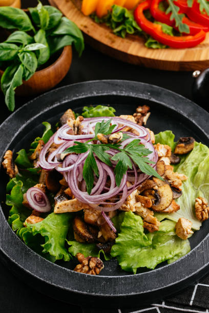 istock Georgian salad with meat on a black background 1283572686