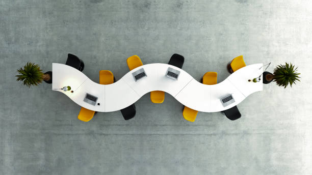 istock Modern meeting room top view with wavy white desk 3D rendering 1283574143