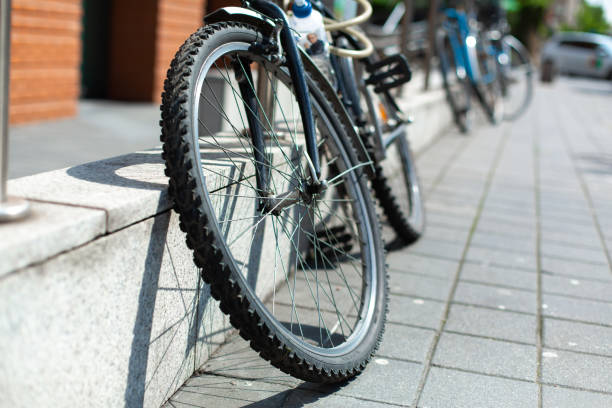 istock Bicycle strapped to the fence. Bicycle parking 1283574407