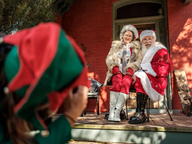 istock Santa and Mrs.Clause pose for photos for Elf 1283574452