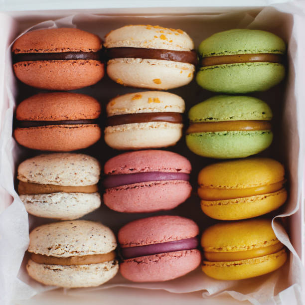 Set of multi-colored tasty french macarons in a box.  Close-up.