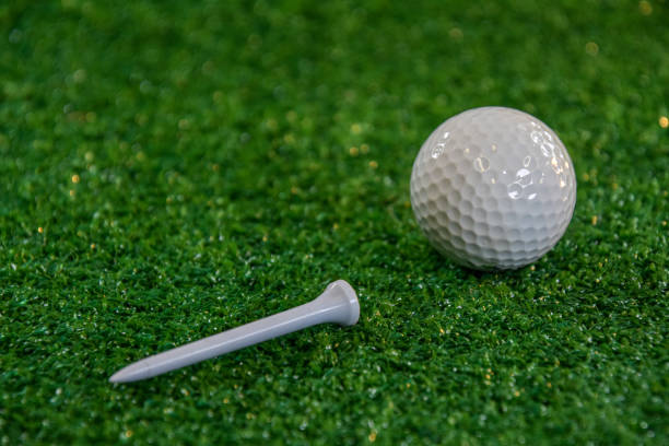 istock Golf ball and  tee on the green 1283574705