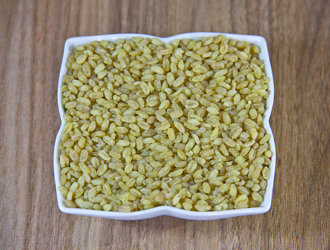 Background of yellow bulgur grains
