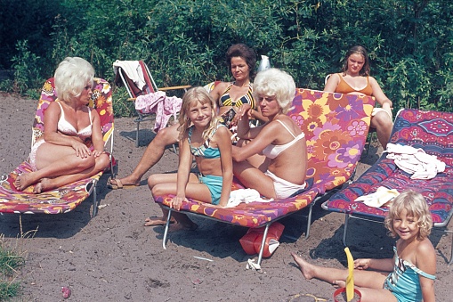 Berlin (West), Germany, 1972. Mothers with their daughters on the weekend on a bathing trip on a Berlin lake.