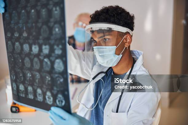 Neurologist Staring At The Patient Brain Images Stock Photo - Download Image Now - MRI Scan, Neurologist, Healthcare And Medicine