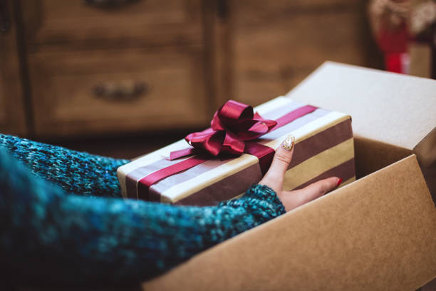 istock Young girl getting parcel during Christmas holidays 1283576210