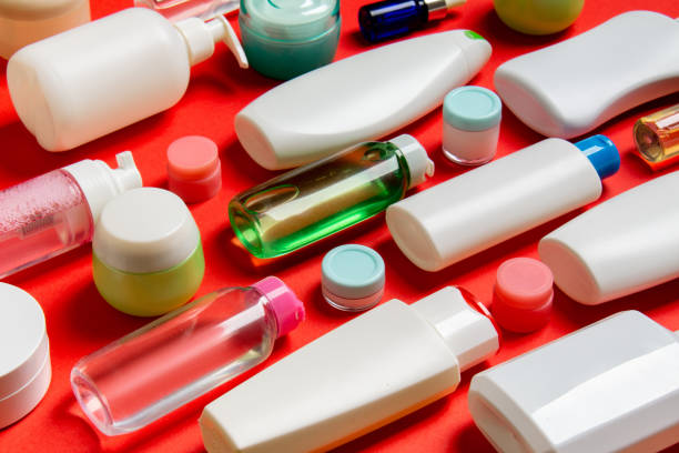 istock Top view of different cosmetic bottles and container for cosmetics on colored background. Flat lay composition with copy space 1283576316