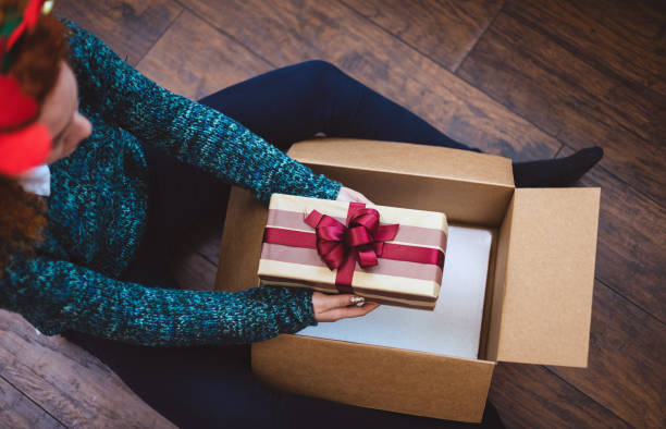 istock Young girl getting parcel during Christmas holidays 1283576350