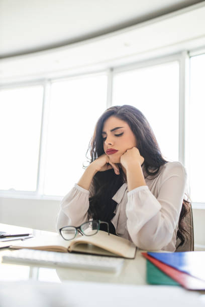istock Businesswoman having problems and working in her modern office 1283580058