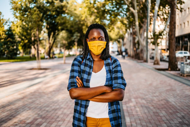 istock Woman with face mask and crossed arms 1283581014