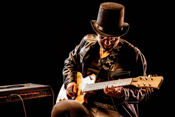 istock Rock musician portrait playing a guitar solo 1283581471