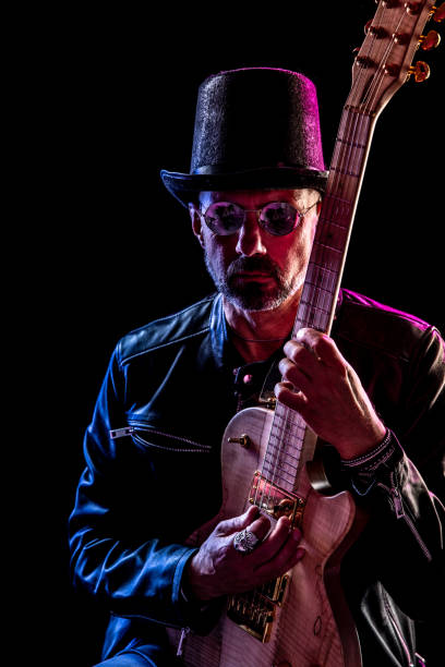 istock Rock musician portrait against black background 1283581474