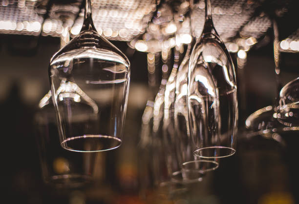 istock Empty glasses for wine above a bar rack in vintage tone. 1283583432