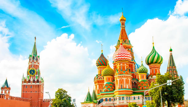 Moscow Kremlin and St Basil's Cathedral wide panoramic view, Russia Panoramic view of Moscow Kremlin, Spasskaya Tower and Saint Basil's church known also as Cathedral of Vasily the Blessed, Russia moscow russia stock pictures, royalty-free photos & images