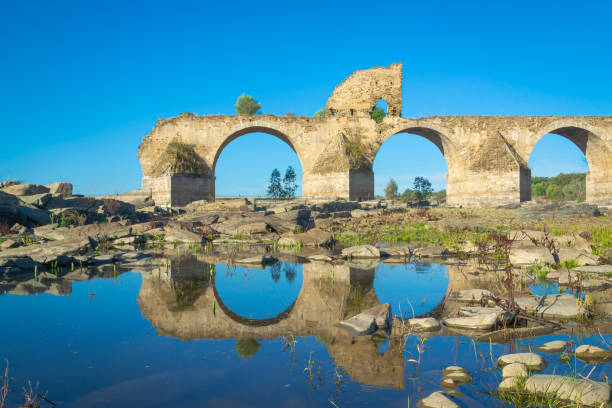 istock Reflection of the bridge in the water river 1283583777