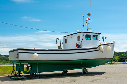 Fishing boat docked on dry land on Cape Breton Island, Nova Scotia, Canada.