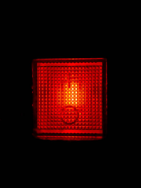 istock Glowing red plastic lamp in the dark. 1283584651