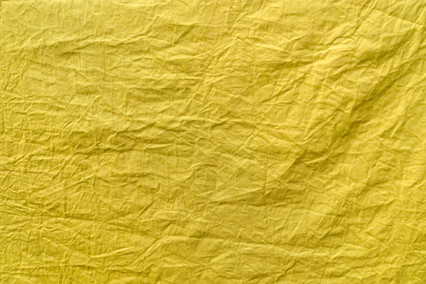 istock Yellow crumpled piece of fabric 1283584678
