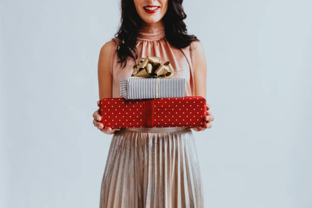 istock Anonymous Woman Holding Christmas Presents, a Close Up 1283586119