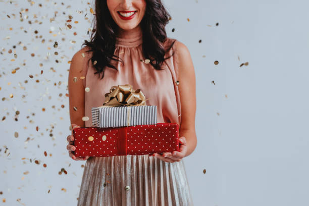 istock Anonymous Woman Holding Christmas Presents, a Close Up 1283586124