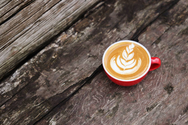 Latte art on old wooden table
