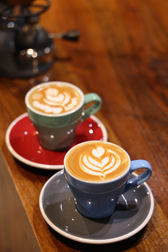 Latte art on old wooden table