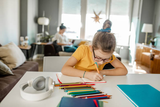 istock A little girl is learning at home 1283589745