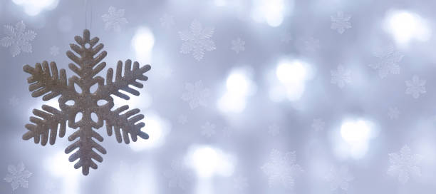 istock Christmas snowflake decoration and blurred lights 1283594201