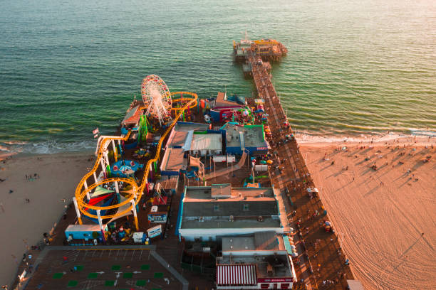 istock Santa Monica Pier at sundown with lights reflected in the Pacific Ocean 1283594293