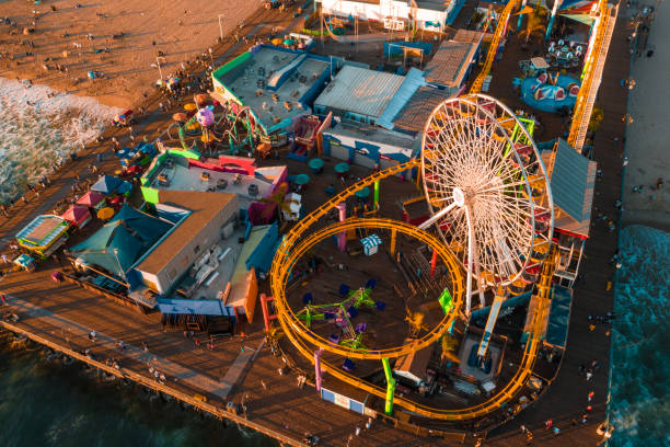 istock Santa Monica Pier at sundown with lights reflected in the Pacific Ocean 1283595032