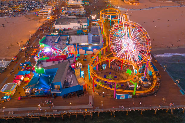 istock Santa Monica Pier at sundown with lights reflected in the Pacific Ocean 1283595058