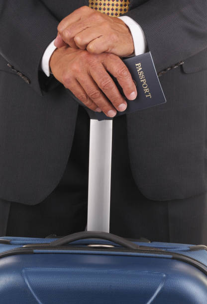 istock Business Traveler with Passport 1283595086