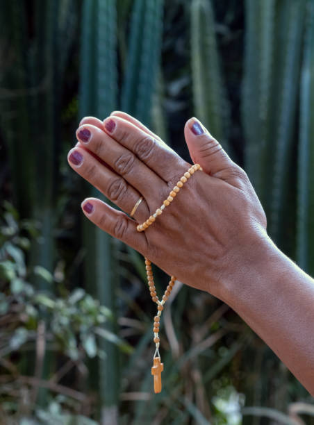 istock Female hand holding a crucifix 1283596818