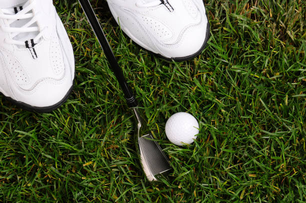 istock Golfers Feet Ball and Iron 1283598244