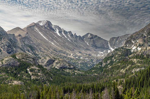 Mountain peak with expansive lake nestled between two majestic peaks