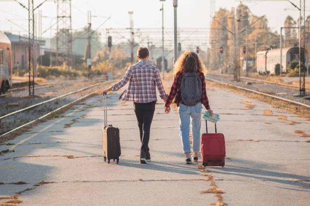 istock Young couple with a suitcase ready for travel 1283598905