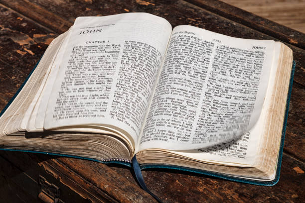 istock Holy Bible open to the book of John 1283598991