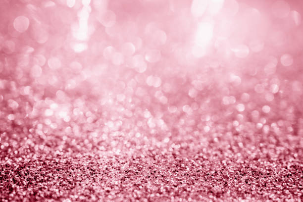 istock Abstract pink gold glitter sparkle texture with bokeh background 1283600096