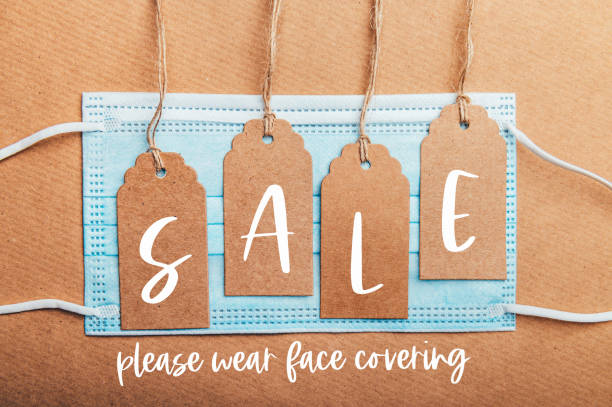 Sale text on price tags with face mask