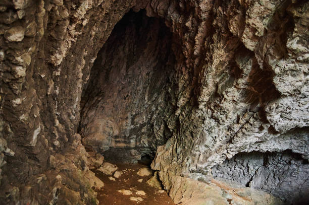 istock stone cave inside. view near the entrance. 1283600437