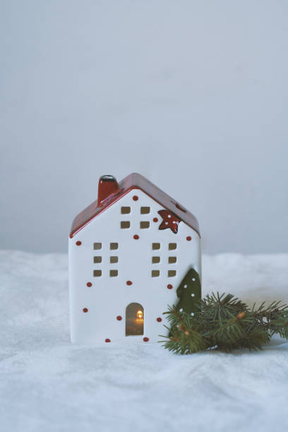 istock Santa's Christmas souvenir house on a light background 1283605516
