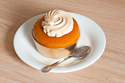 French pastry : baba au rhum. It's a brioche soaked of rum with cream on top.